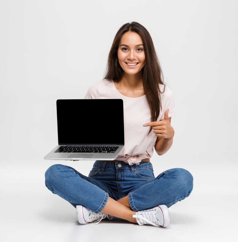 Woman pointing at a laptop screen